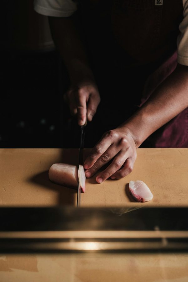 Slicing fish on the board
